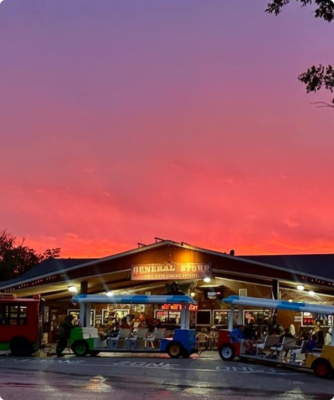 A vibrant sunset casts colorful hues over a market
