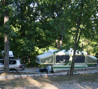 A couple of vehicles parked in a spacious parking lot