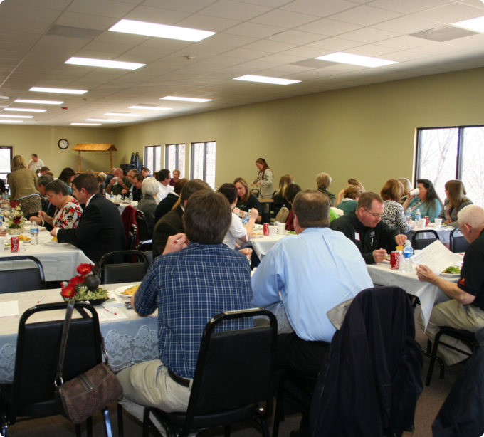 A group of people seated at tables