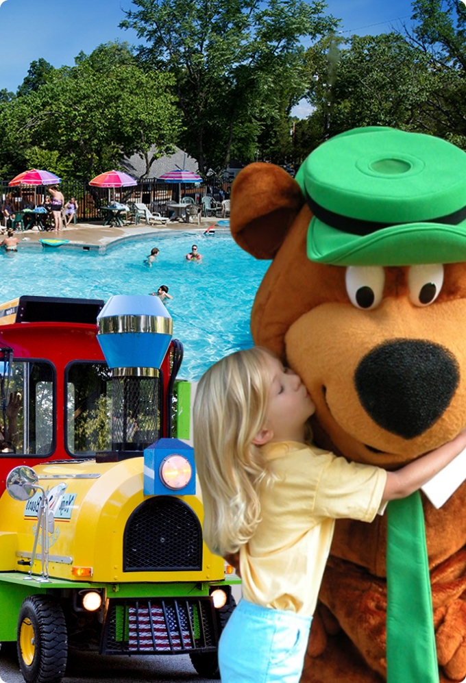 a girl kissing a large brown bear