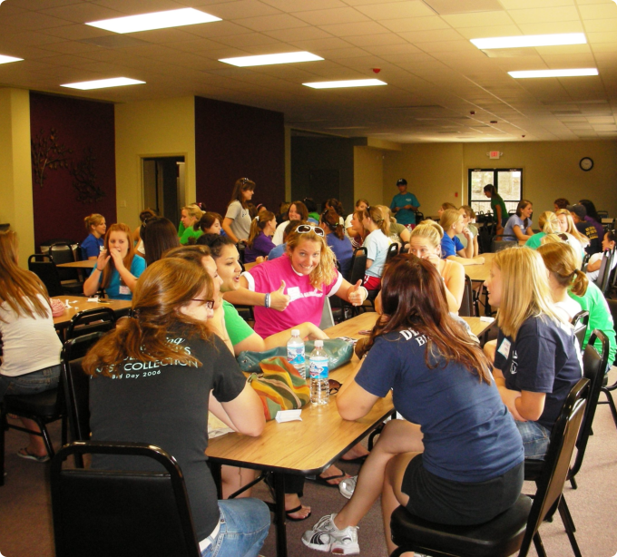 A diverse group of people seated around a table