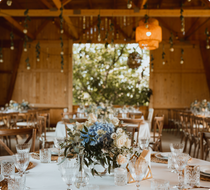 A white canopy drapes elegantly over a set of chairs